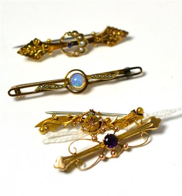 Lot 376 - An opal bar brooch, an amethyst openwork bar brooch and two other bar brooches