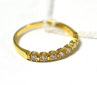 Lot 383 - An 18ct gold diamond half loop ring, total estimated diamond weight 0.35 carat approximately