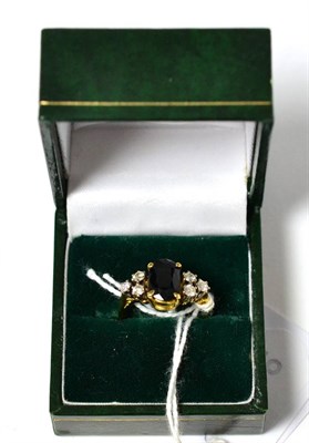 Lot 389 - A sapphire and diamond ring on an 18ct gold band