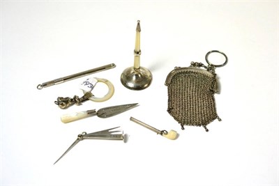 Lot 399 - A silver mounted mesh purse stamped 800, mother-of-pearl and silver rattle, silver propelling...