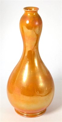 Lot 431 - A William Moorcroft Burslem pottery baluster vase with orange lustre glaze, impressed marks and old