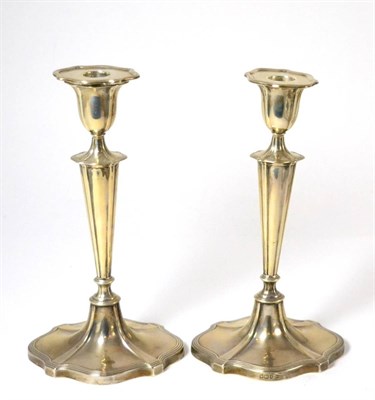 Lot 432 - A pair of silver Walker & Hall candlesticks