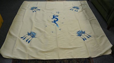 Lot 527 - An Chinese cream silk bed cover embroidered is blue silk threads with a dragon to the centre...