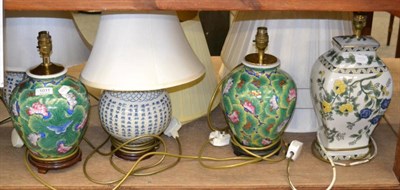 Lot 1011 - A pair of Chinese blue and white table lamps, a pair of Chinese green ground table lamps and...