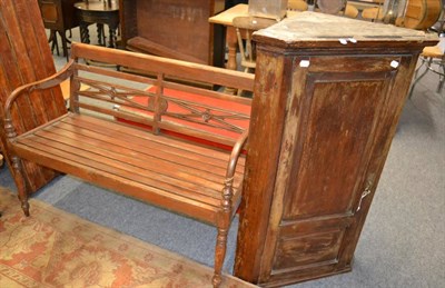 Lot 1041 - A mahogany bench and a corner cupboard (2)