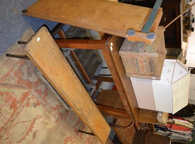 Lot 1042 - A mahogany school laboratory table, three advertising crates, vintage gym equipment, dolls...