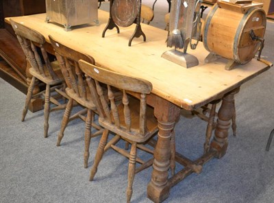 Lot 1046 - A pine farmhouse kitchen table together with six Windsor type chairs