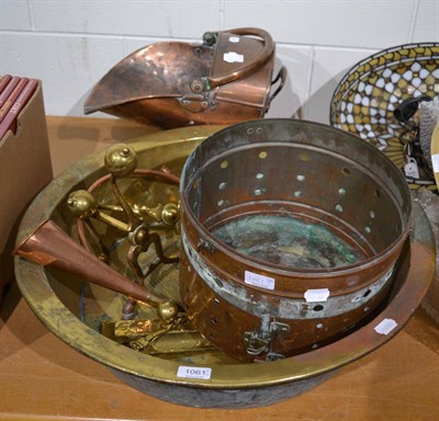 Lot 1061 - Large brass bowl, copper planter, coal helmet, pair of andirons, chestnut roaster, copper horn, etc