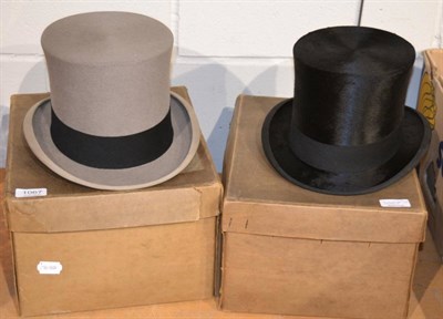 Lot 1067 - Dunn & Co black silk top hat box, in original card box and an Austin Reed grey felt top hat, in...