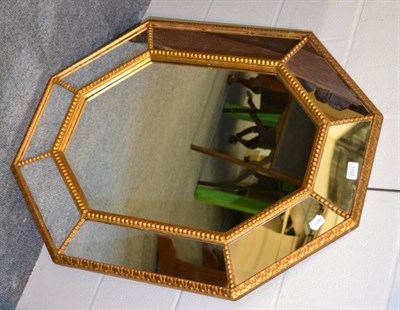 Lot 1102 - A sectional gilt framed mirror