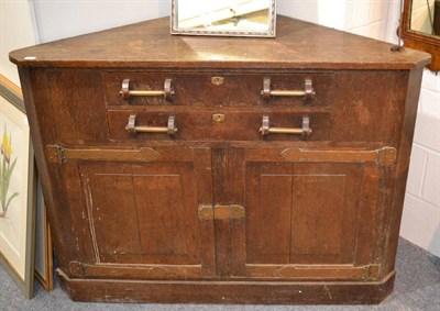 Lot 1103 - An Arts & Crafts corner cupboard