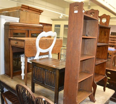 Lot 1108 - A small reproduction oak coffer, two small narrow open bookcases, a pair of wheel back chairs,...