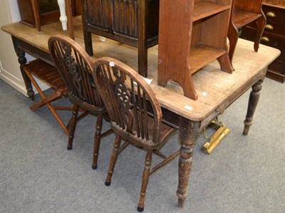 Lot 1109 - A substantial pine farmhouse table fitted with a drawer