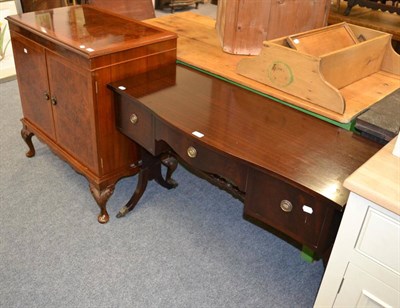 Lot 1118 - A small reproduction writing desk together with a Charles Sheraton reproduction music cabinet