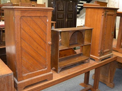 Lot 1122 - A Gothic pot cupboard with brass hardware, a plain Gothic pot cupboard and a wall hanging...