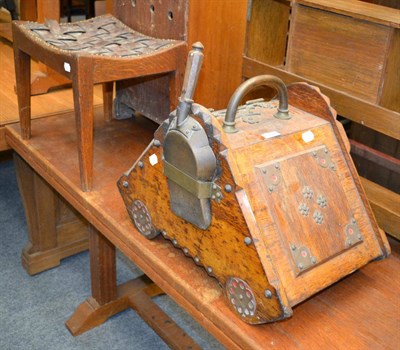 Lot 1124 - A leather seated footstool and a Christopher Dresser coal box