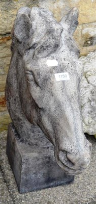 Lot 1150 - A composition garden ornament of a horse's head