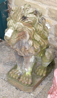 Lot 1153 - A composition garden ornament of a seated lion