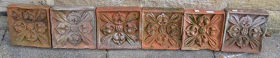 Lot 1156 - A set of six hand made clay terracotta brick inserts, 23cm by 24cm