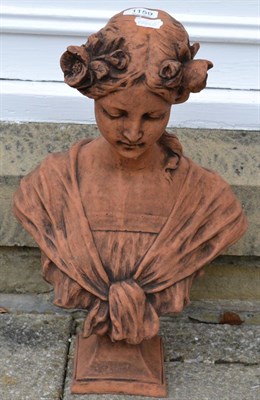 Lot 1159 - A composition bust in the Art Nouveau style of a girl with flowers in her hair, 46cm high