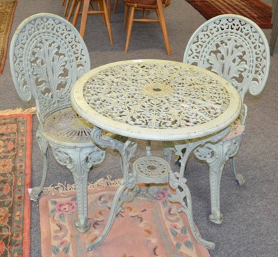 Lot 1174 - A painted metal garden table and two chairs