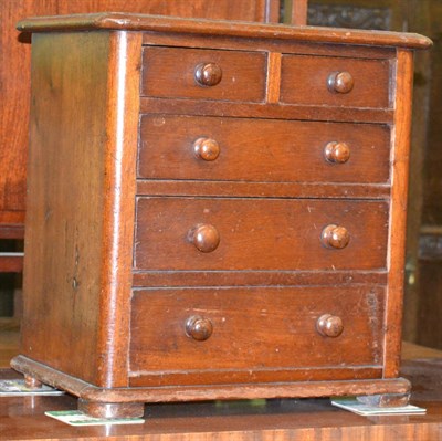 Lot 1204 - A Victorian mahogany miniature chest of drawers