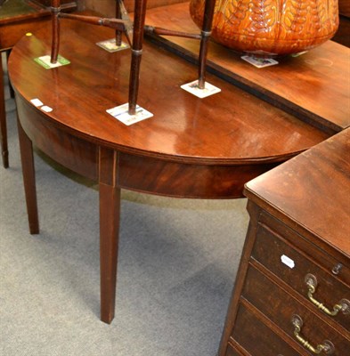 Lot 1209 - A mahogany demi-lune side table