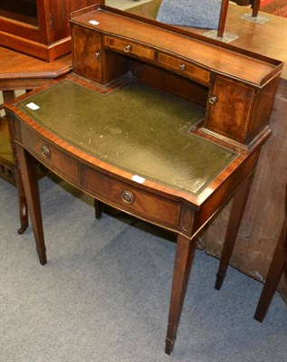 Lot 1212 - A small reproduction oak writing desk