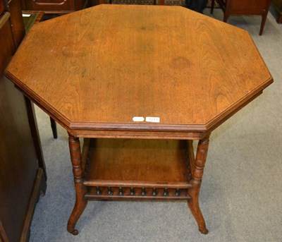 Lot 1213 - A Victorian oak occasional table, the octagonal top on turned uprights joined by a shelf...