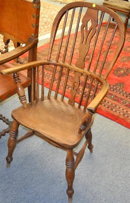 Lot 1230 - A 19th century elm Windsor armchair