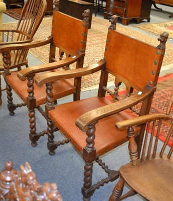 Lot 1231 - A pair of 20th century oak and leather close-nailed armchairs