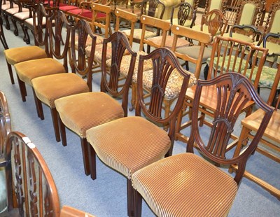 Lot 1237 - A set of six shield back dining chairs