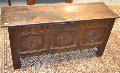 Lot 1261 - A small 18th century carved oak six plank coffer