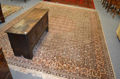 Lot 1262 - A machine made carpet of Tabriz design, the ivory Herati field with geometric medallion enclosed by