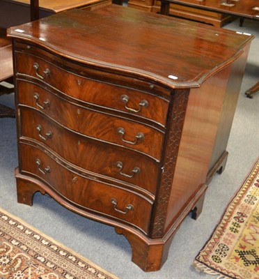 Lot 1265 - An early 19th century mahogany Chippendale style serpentine fronted four height chest of...