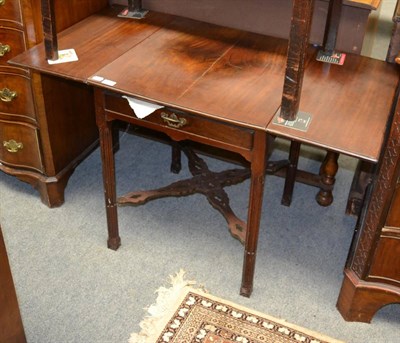 Lot 1267 - A 19th century mahogany drop leaf occasional table the fluted leg joined by a pierced X form...