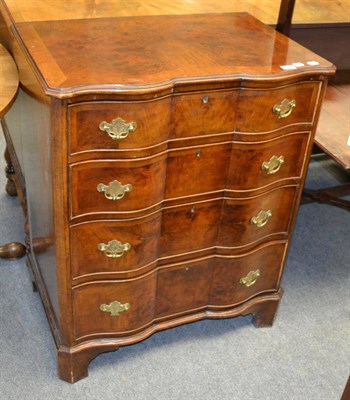 Lot 1268 - A late 19th/early 20th century cross banded and walnut mahogany shaped chest of drawers