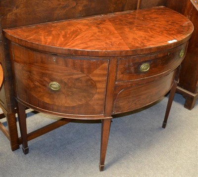 Lot 1279 - A George III mahogany demi lune sideboard