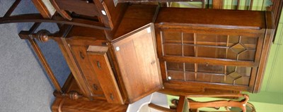 Lot 1285 - An early 20th century oak bureau bookcase