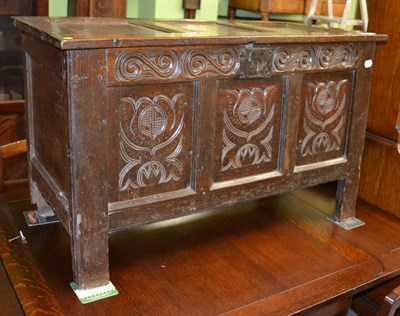 Lot 1286 - An 18th century carved oak three panel coffer