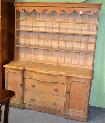 Lot 1302 - A pine dresser and rack