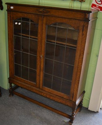 Lot 1306 - Glazed oak bookcase