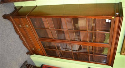 Lot 1308 - A glazed mahogany bookcase fitted with two drawers