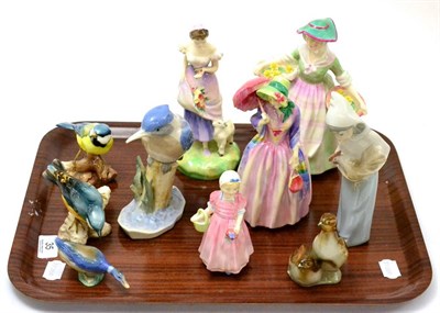 Lot 35 - A group of porcelain ornaments including four Royal Doulton figures 'Daffy-Down-Dilly', 'Miss...