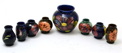 Lot 57 - A group of seven miniature Moorcroft vases including, Poppy, Hibiscus and Anemone, together...