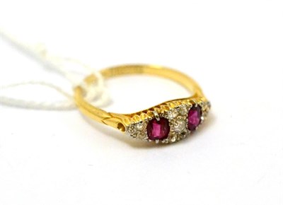 Lot 69 - A diamond and ruby set ring