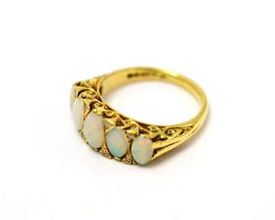 Lot 71 - An 18ct gold opal and diamond ring