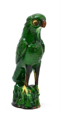 Lot 113 - A Qing dynasty (late 19th century) green glazed model of a parrot, 20cm