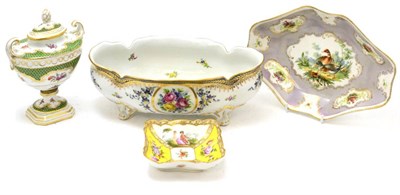 Lot 177 - A Continental porcelain twin handled urn and cover, an oval centre bowl on four feet, an oval...