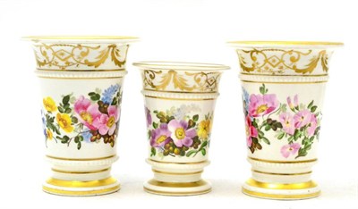 Lot 197 - A set of three English gilt highlighted spill vases, decorated with floral sprays